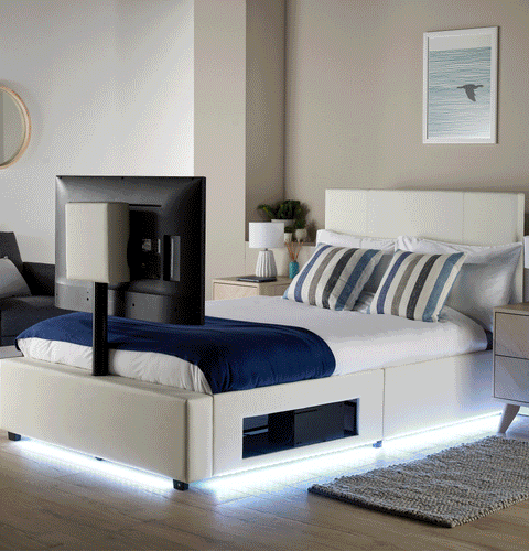 Luxury white TV bed with built in LED strip lighting, plus upholstered headboard, and a unique rotating TV mount.