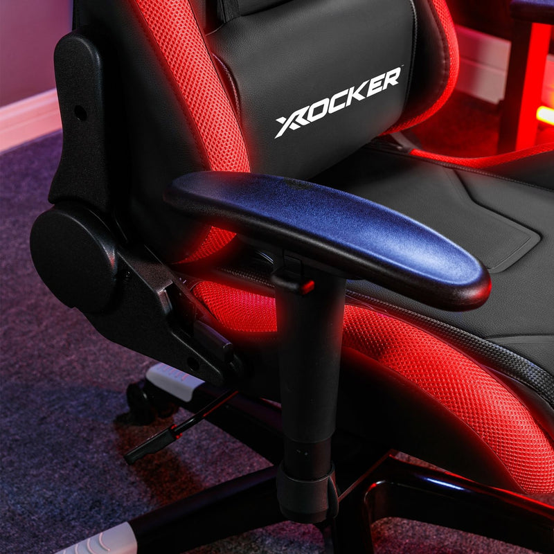 Red and black gaming chair with 'X-Rocker' branding on a blurred background