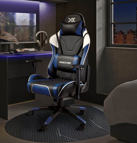 Agility Gaming chair with blue accents in a room setup with a desk and computer monitor.