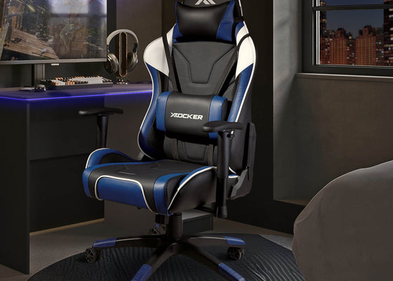Agility Gaming chair with blue accents in a room setup with a desk and computer monitor.