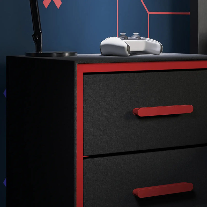 Black dresser with red handles against a dark blue wall with geometric patterns