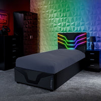 Modern bedroom with a bed, nightstands, and colorful wall design.