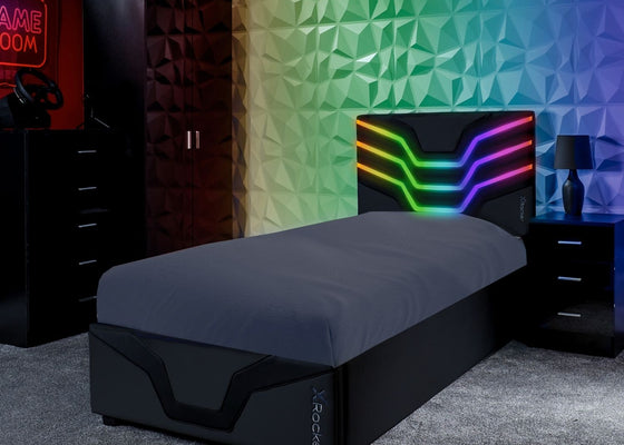 Modern bedroom with a bed, nightstands, and colorful wall design.