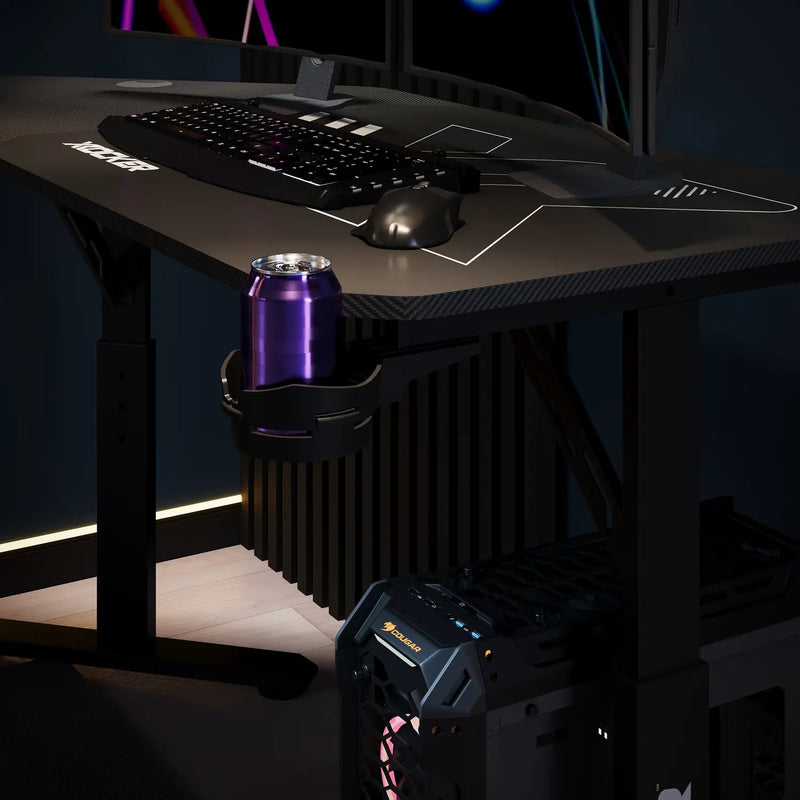 Cougar Corner Gaming desk setup with computer equipment and a can on a dark background