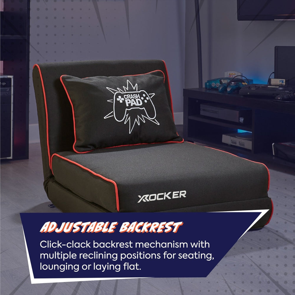 Gray gaming chair with adjustable backrest and X rocker branding in a room setting.