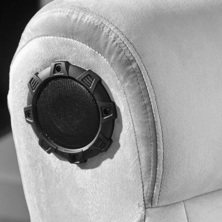 Black speaker grille on a gray car seat