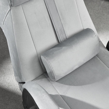Gray office chair with a headrest in a minimalistic setting