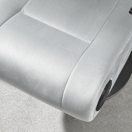 Close-up of a gray recliner chair with a focus on the armrest and seat.