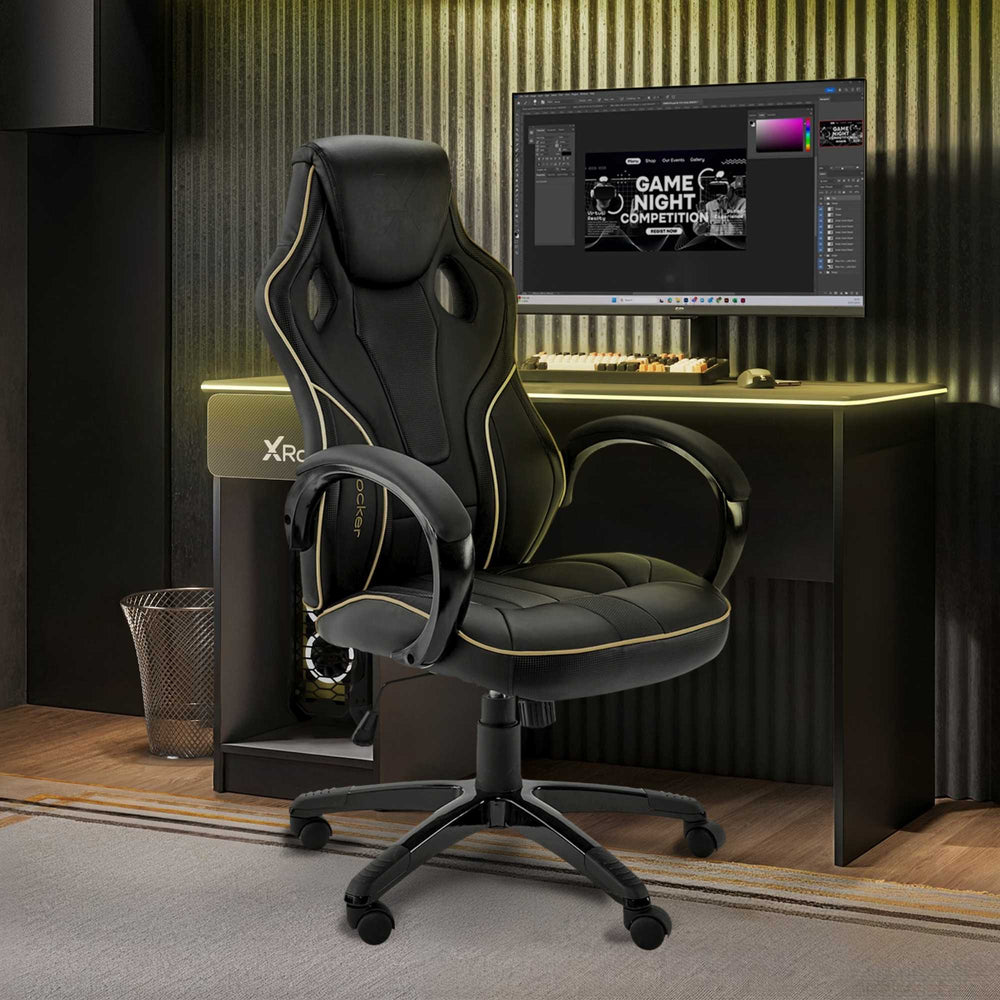 Black gaming chair in front of a computer desk with a monitor displaying a game night theme.