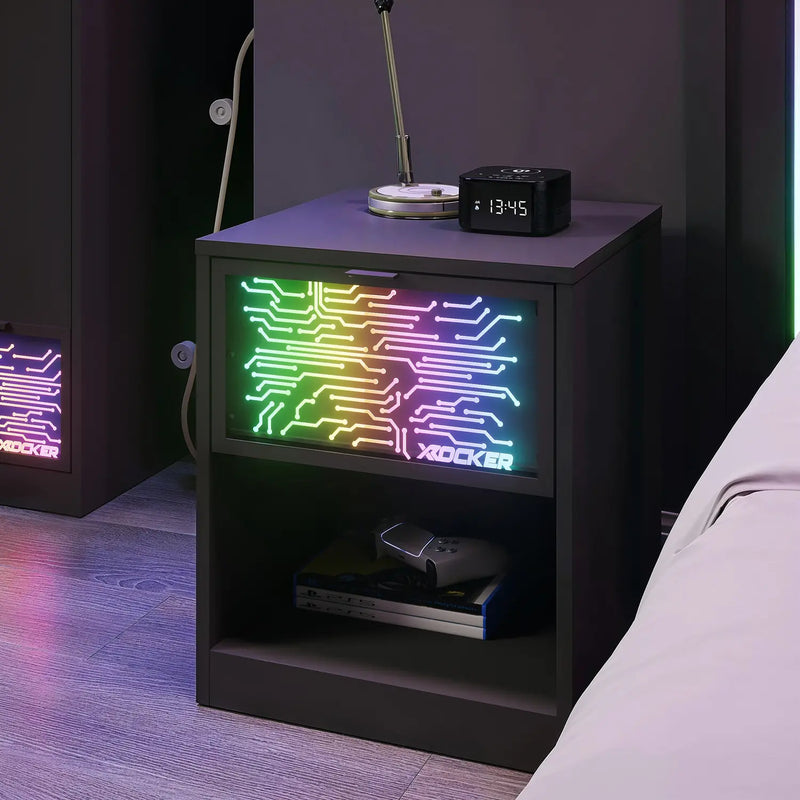 Bedside table with electronic device displaying colorful circuit design and X rocker branding.