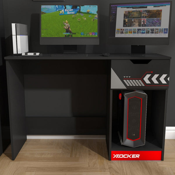 Gaming setup with two monitors, a gaming console, and a computer tower on a black desk.