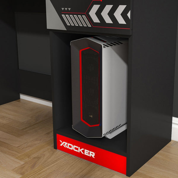 Gaming computer tower on a black stand with 'X ROCKER' branding.