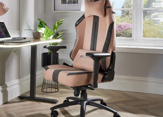 Beige and black office chair in a room with a desk and window.