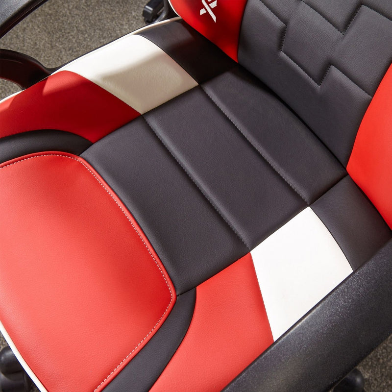 Close-up of a red and black gaming chair with a visible brand logo.