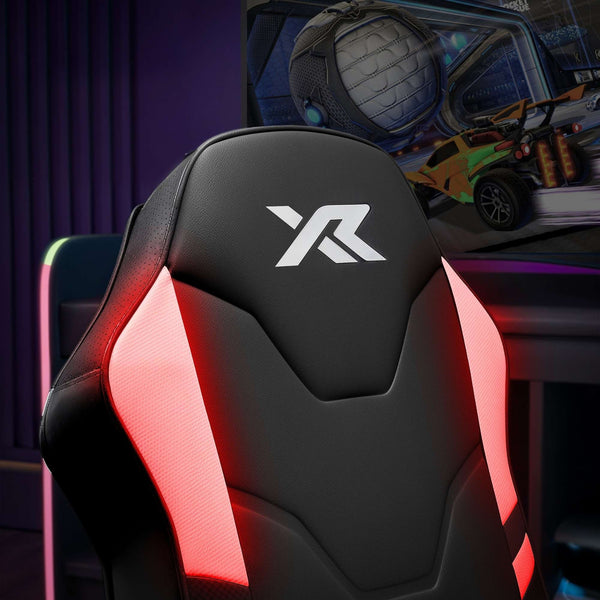 Gaming chair with red accents and 'XR' logo in a gaming setup.