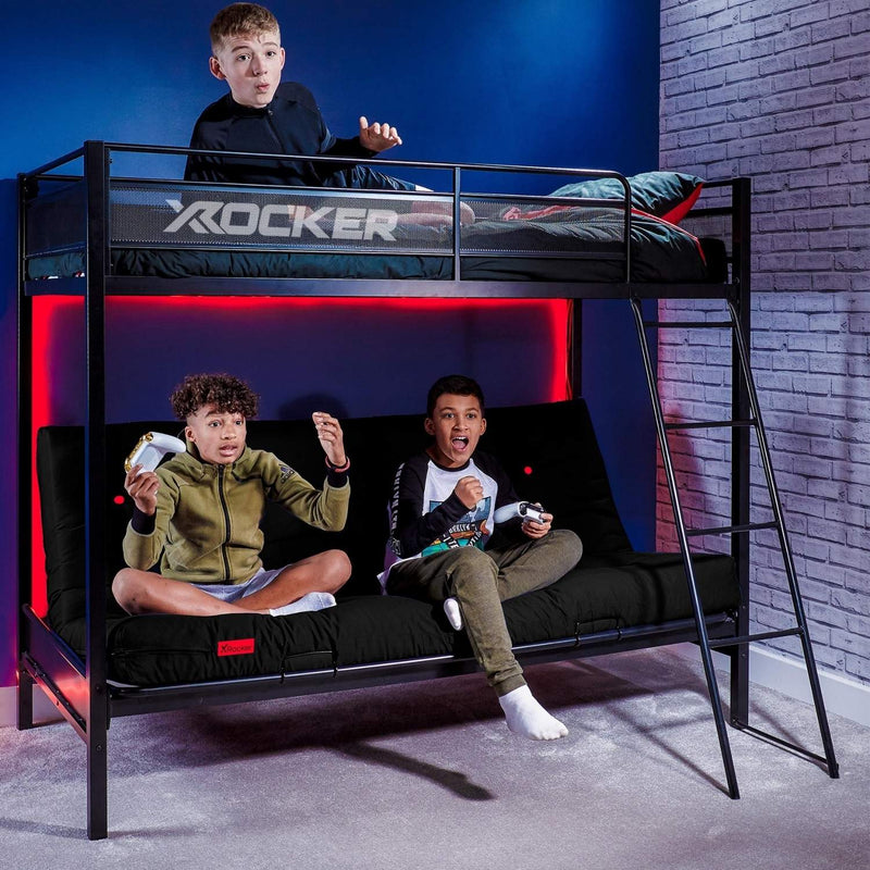 Children playing video games on a black loft bed with 'X rocker' branding.