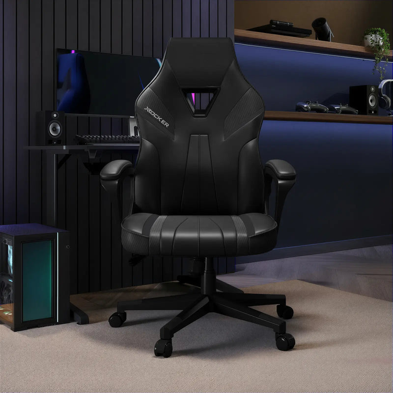Black gaming chair in a room with computer equipment