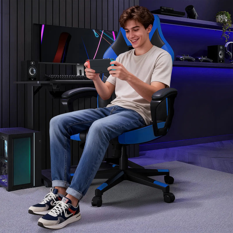 Person sitting in a gaming chair using a smartphone in a room with gaming equipment.