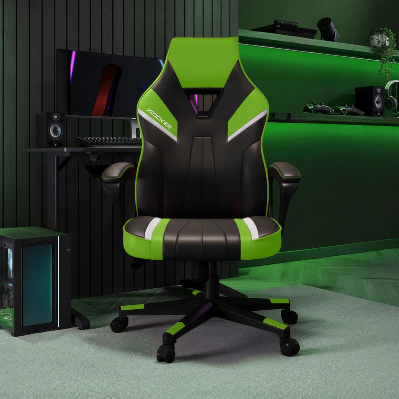 Gaming chair with green and black design in a room setup with computer equipment.