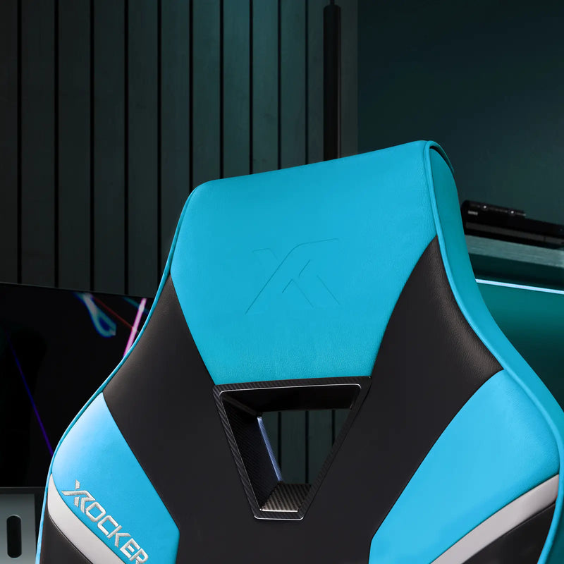 Blue and black gaming chair with X rocker logo in a room setting.