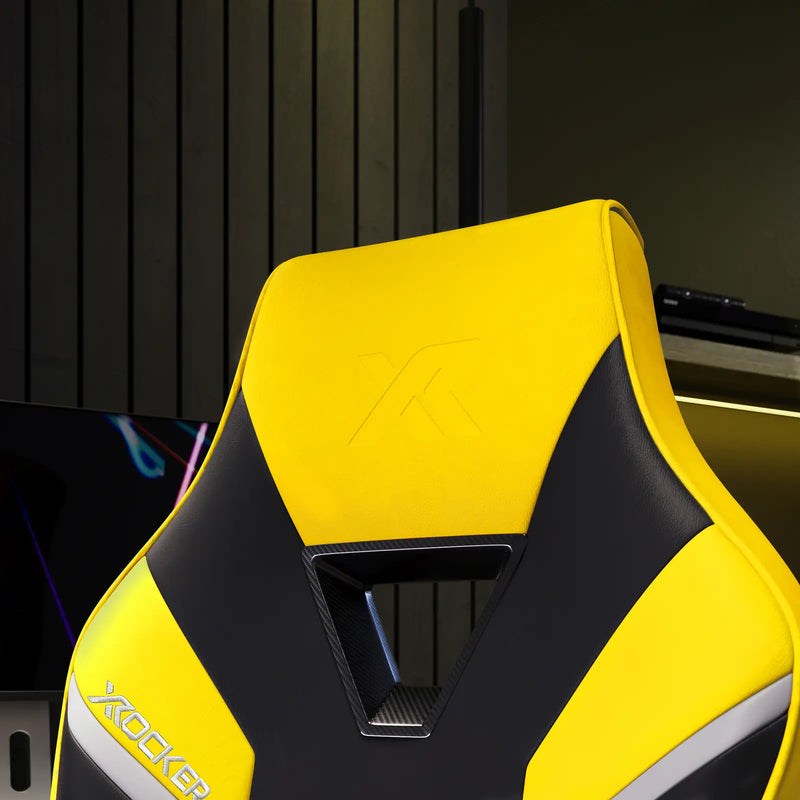 Yellow and black gaming chair with X-Rocker logo on a dark background