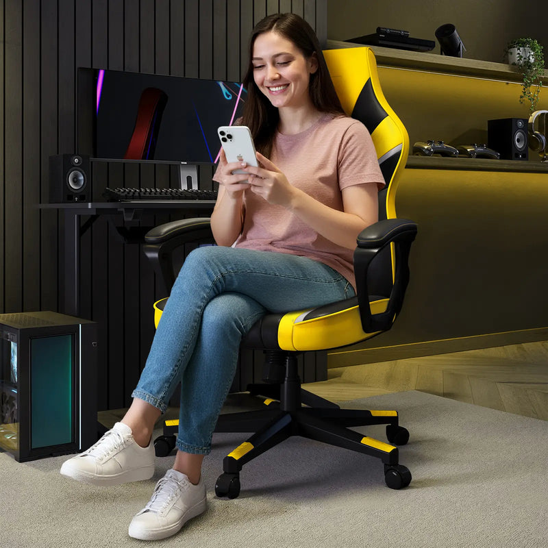 Woman sitting in a yellow and black gaming chair using a smartphone in a room with gaming setup.