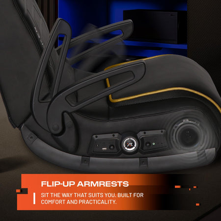 Black gaming chair with flip-up armrests and text highlighting comfort and practicality.