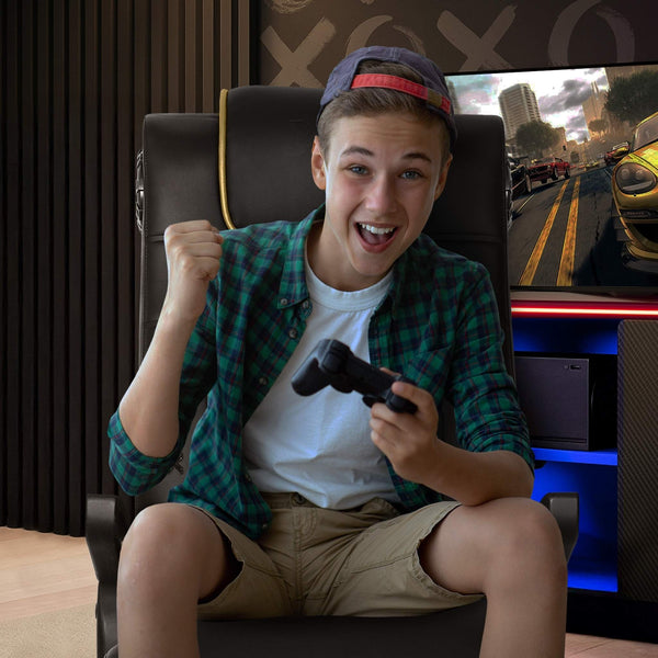 Person playing video games in a gaming chair with a controller, surrounded by gaming equipment.