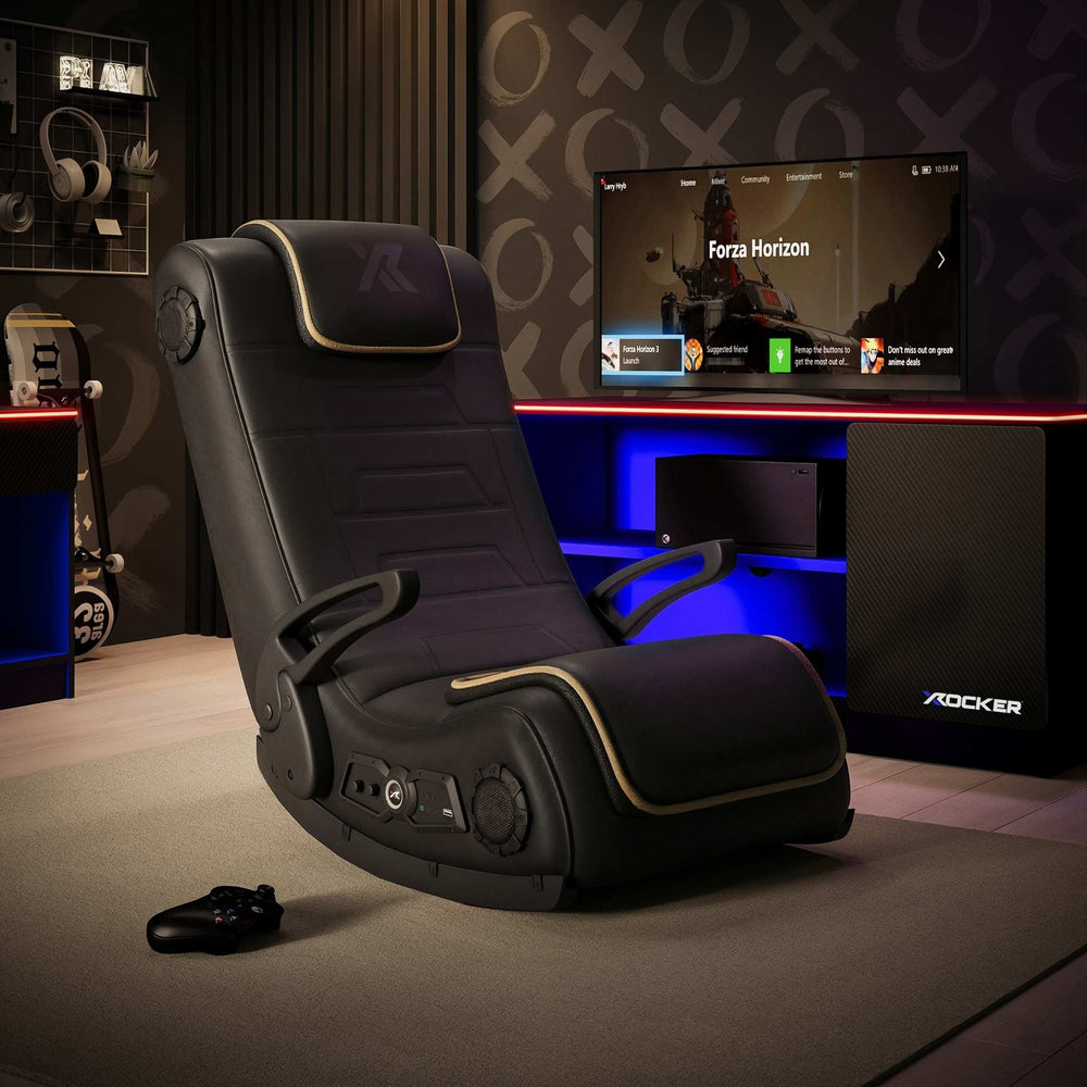 Gaming chair in a room with a TV displaying a game, surrounded by gaming accessories.