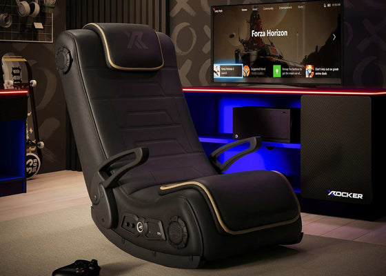 Gaming chair in a room with a TV displaying a game, surrounded by gaming accessories.