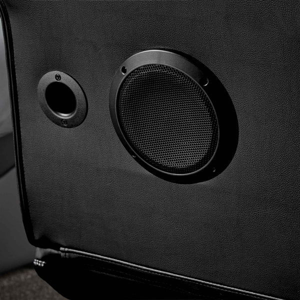 Close-up of a black speaker enclosure with a subwoofer