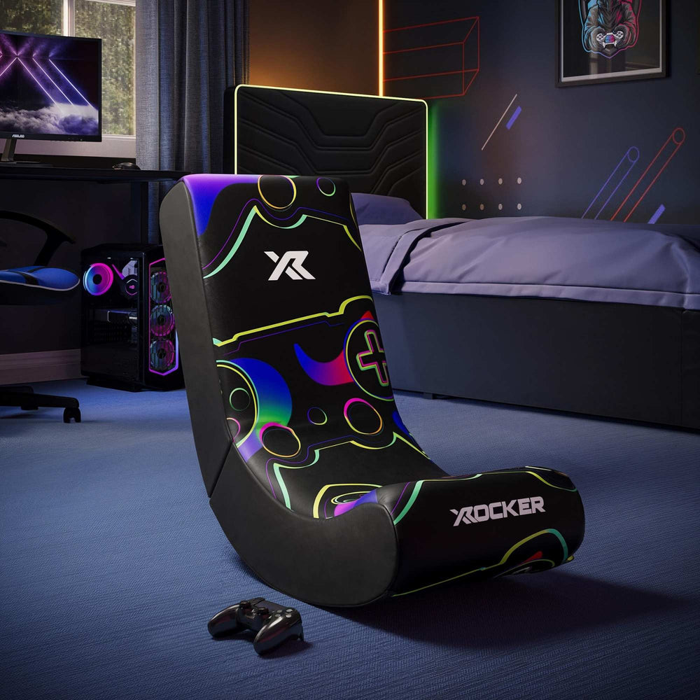 Gaming chair with colorful design in a room setup with a TV and gaming accessories.