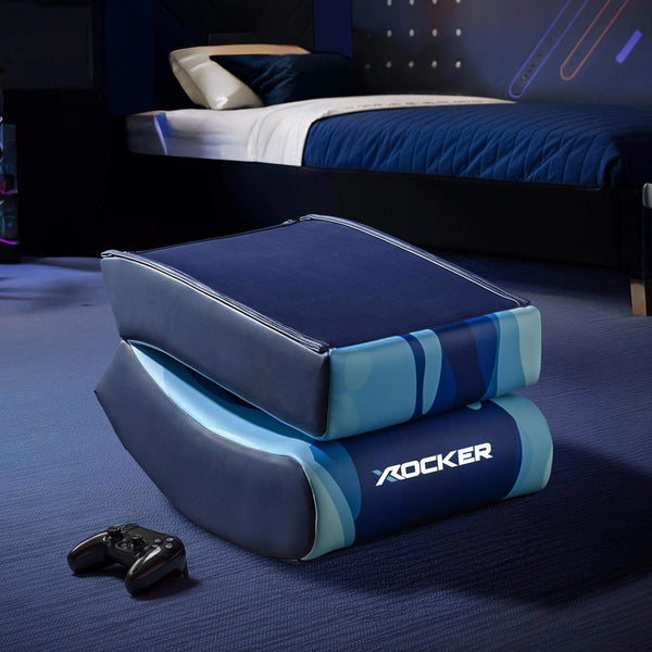 Blue gaming seat with 'X Rocker' branding on a dark surface.