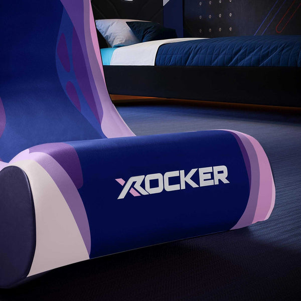 Gaming chair with X rocker logo in a room setting