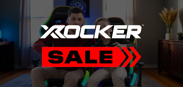 Two people sitting on Rocker gaming chairs with a 'X rocker Sale' banner overlay.