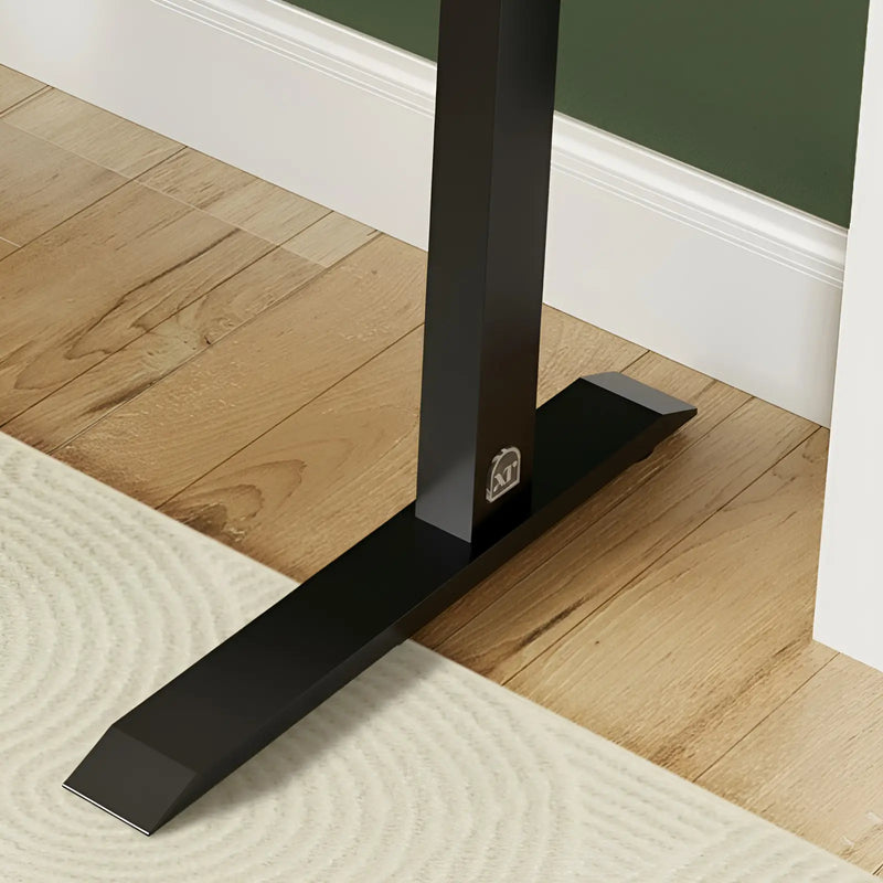 Black metal stand on a wooden floor with a white baseboard.