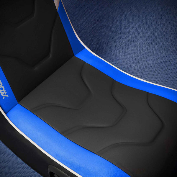 Close-up of a gaming chair with blue accents and 'DXRacer' branding.