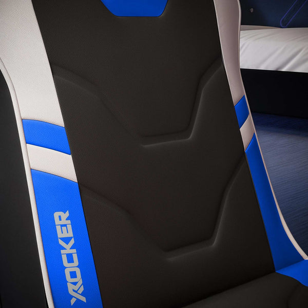 Close-up of a black and blue gaming chair with 'X rocker' branding.