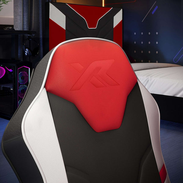 Gaming chair with red and white 'X Rocker' logo in a room setting