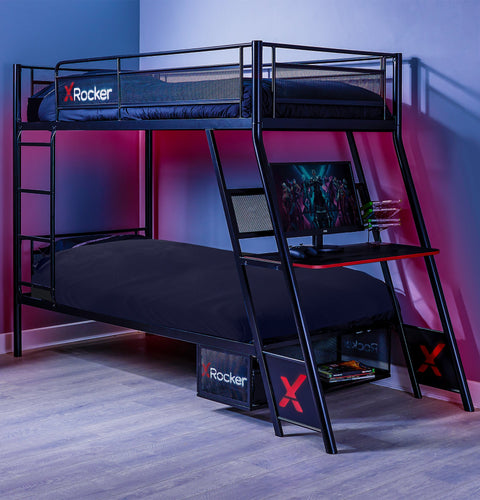 Black bunk bed with X rocker branding in a room with pink and blue walls.