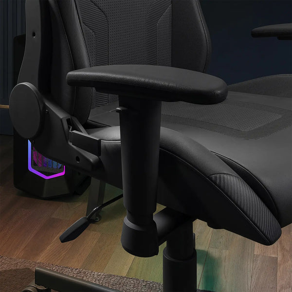 Black gaming chair with RGB lighting on a wooden floor.