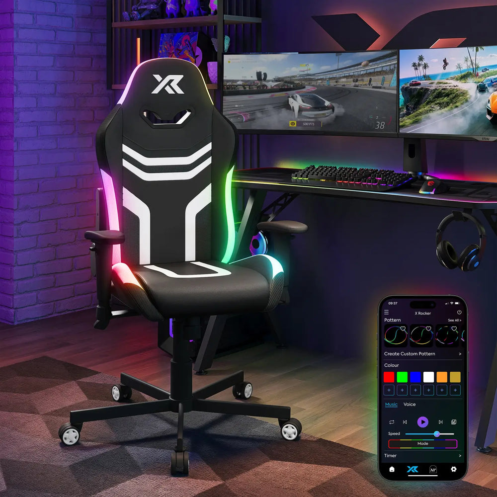Agility Compact Gaming chair with RGB lighting in a room setup with gaming monitors and accessories.