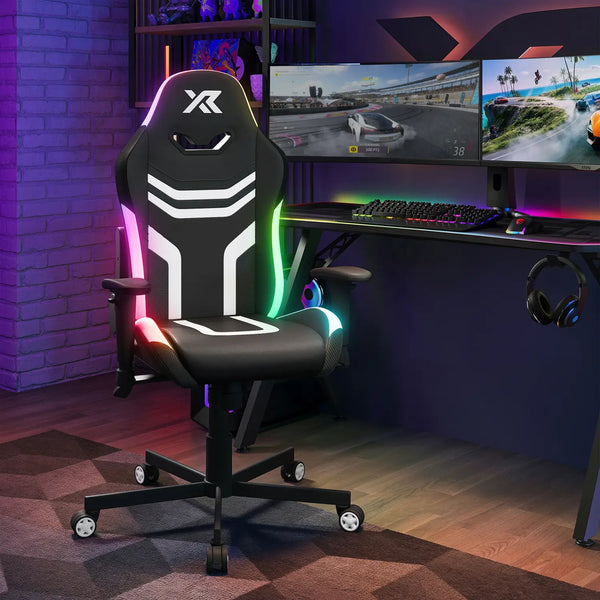 Gaming chair with RGB lighting in a gaming setup with multiple monitors and accessories.