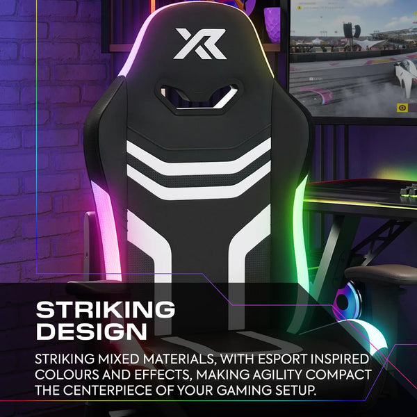 Gaming chair with RGB lighting in a gaming setup, featuring the brand 'X Rocker'.