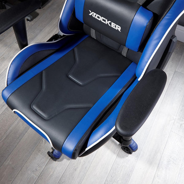 Blue and black gaming chair with X rocker logo on a wooden floor.