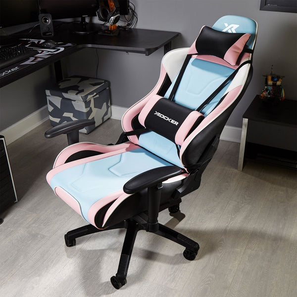 Gaming chair with pink and blue design in a room setting