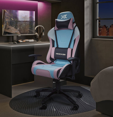 Agility Gaming chair with pink and blue accents in a room setup with a monitor and headphones.