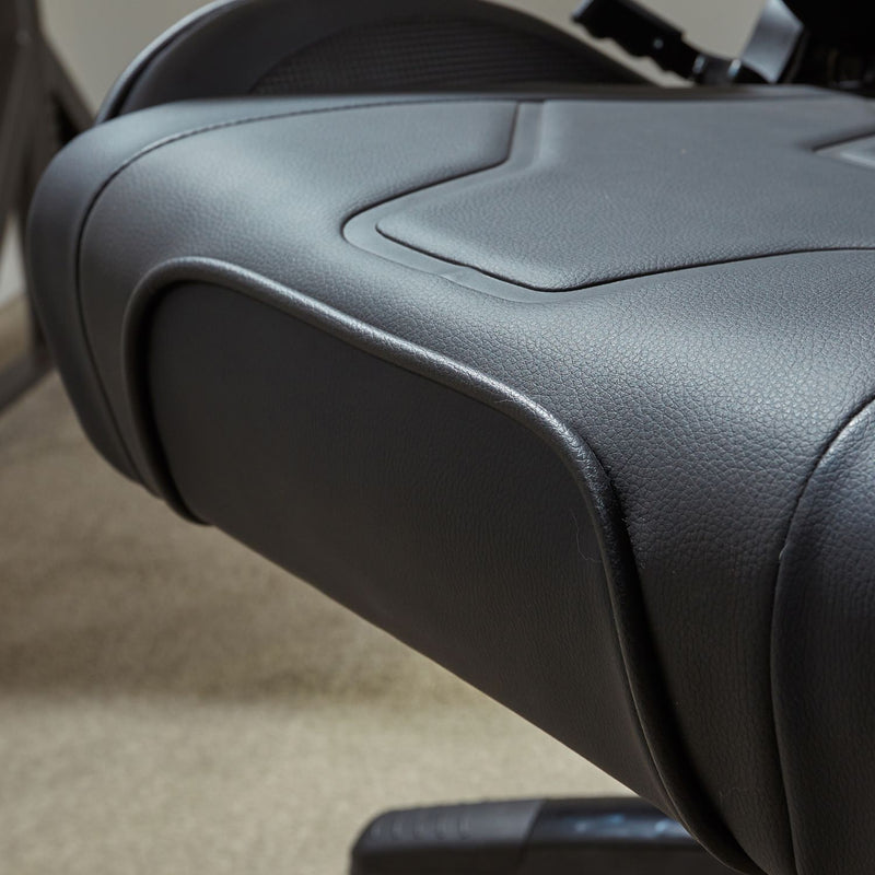 Close-up of a gaming chairs seat with a blurred background