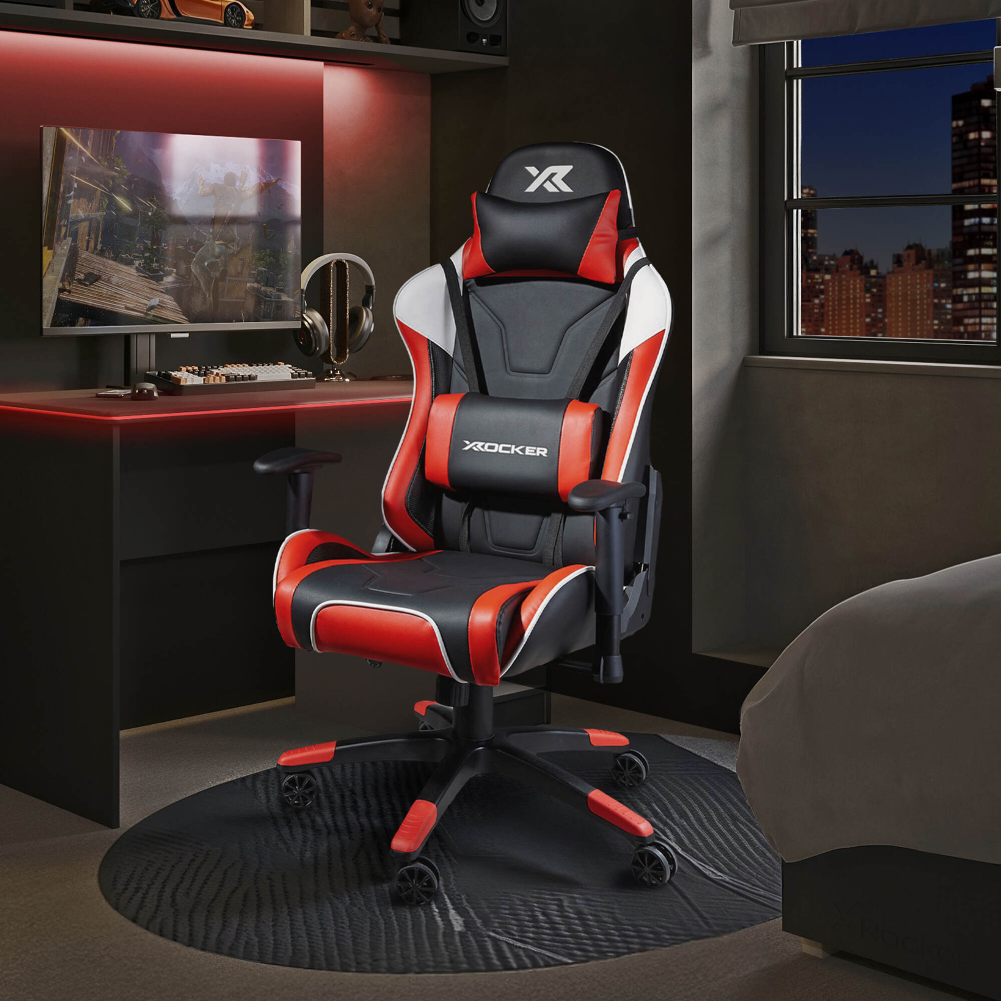 Agility Gaming chair with red accents in a room setup with a desk and monitor.