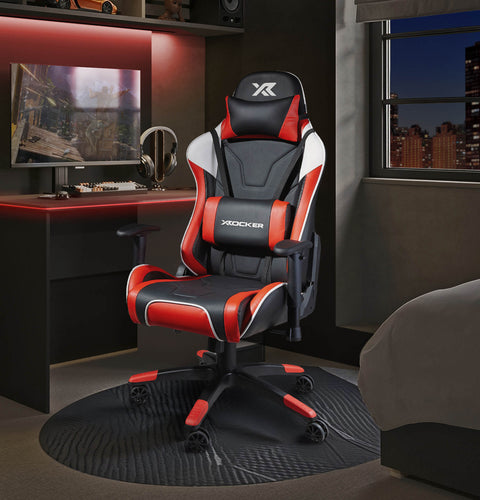 Agility Gaming chair with red accents in a room setup with a desk and monitor.